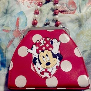 Disney mini hand bag. Cute Minnie Mouse design. Red bag with white polka dots.